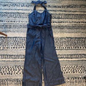 Anthropology jump suit.this material has little shiny.